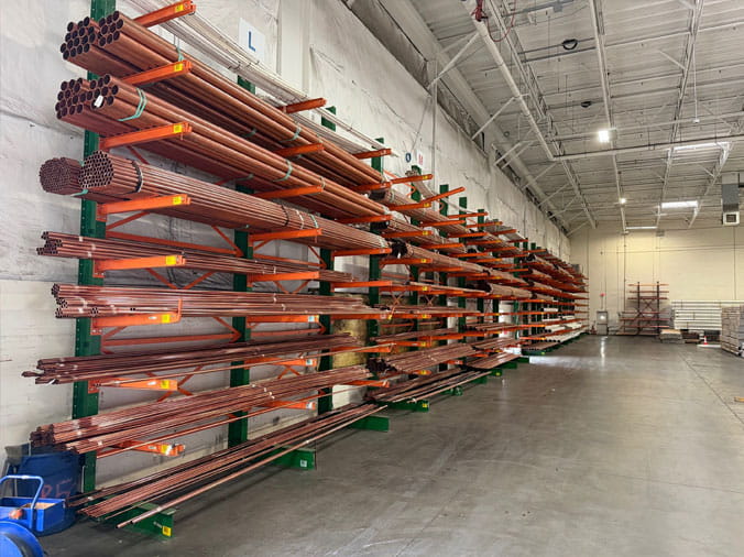 Copper pipe on racks in the Hughes Supply Phoenix warehouse